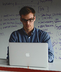 guylaptopwhiteboard200x237 - Copy